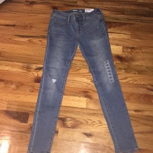 Rockstar jeans denim jeans with one rip in them!